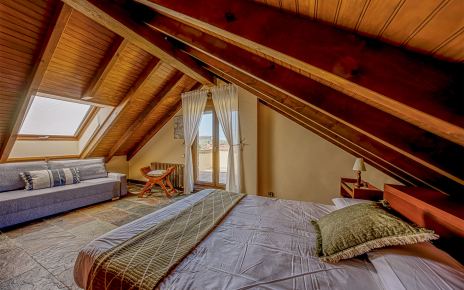 First-floor bedroom with sloping ceilings. Mind your head